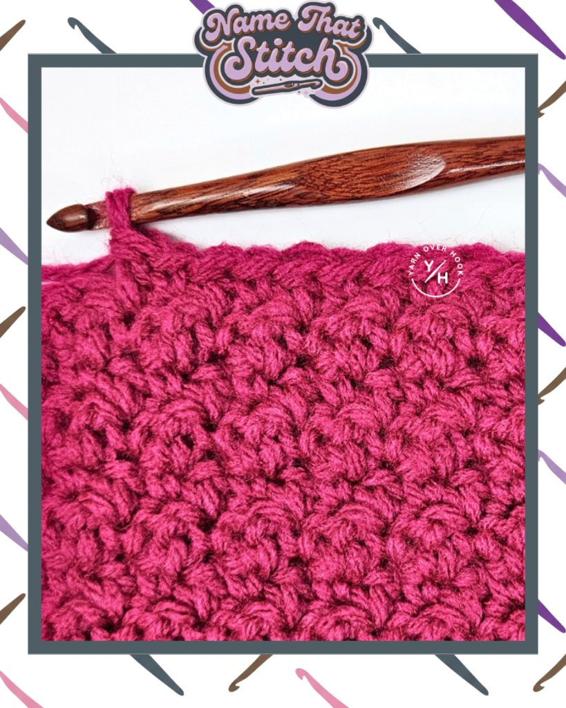 Close-up of a crocheted fabric with a dense, repeating textured stitch pattern in deep pink yarn, shown alongside a wooden crochet hook, featured as part of the Name That Stitch daily crochet puzzle. View more at NameThatStitch.com