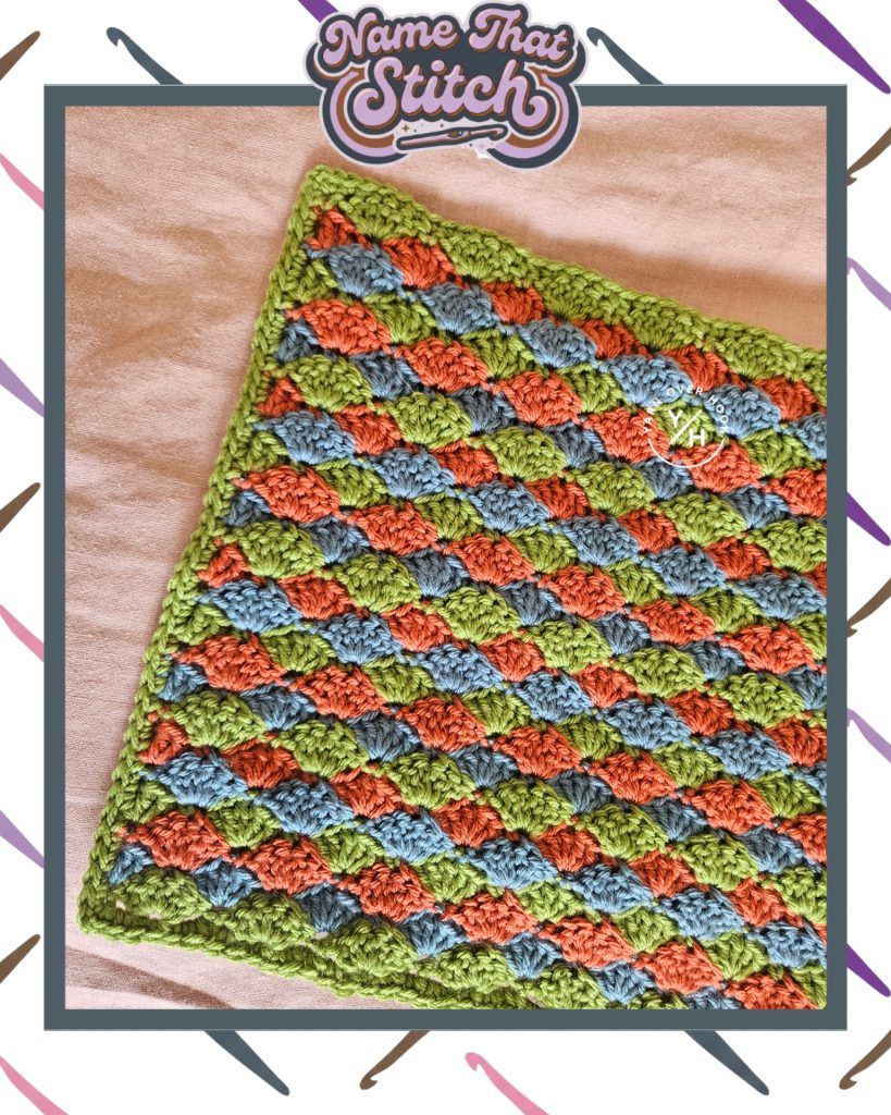 Close-up of a crocheted fabric featuring a repeating textured stitch pattern worked in alternating green, rust, and blue yarn, shown as part of the Name That Stitch daily crochet puzzle. View more at NameThatStitch.com