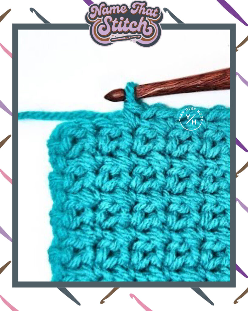Close-up of a crocheted fabric displaying a repeating stitch pattern worked in a teal yarn, with a wooden crochet hook and featured as part of the Name That Stitch daily crochet puzzle. View more at NameThatStitch.com