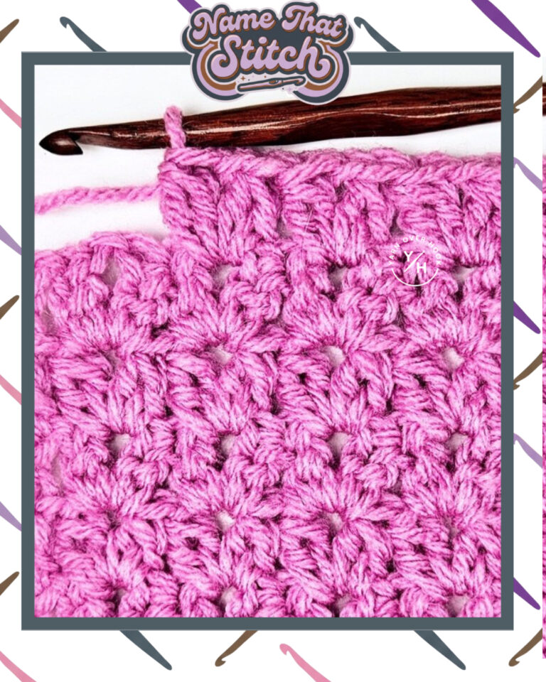 Close-up of a crocheted fabric displaying a repeating stitch pattern worked in pink yarn, with a wooden crochet hook and featured as part of the Name That Stitch daily crochet puzzle. View more at NameThatStitch.com