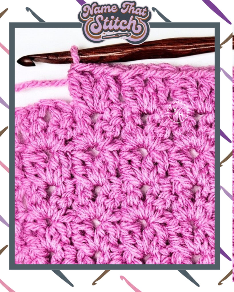 Close-up of a crocheted fabric displaying a repeating stitch pattern worked in pink yarn, with a wooden crochet hook and featured as part of the Name That Stitch daily crochet puzzle. View more at NameThatStitch.com