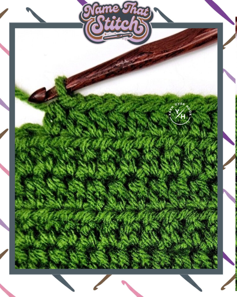 Close-up of a crocheted fabric displaying a repeating stitch pattern worked in green yarn, with a wooden crochet hook and featured as part of the Name That Stitch daily crochet puzzle. View more at NameThatStitch.com