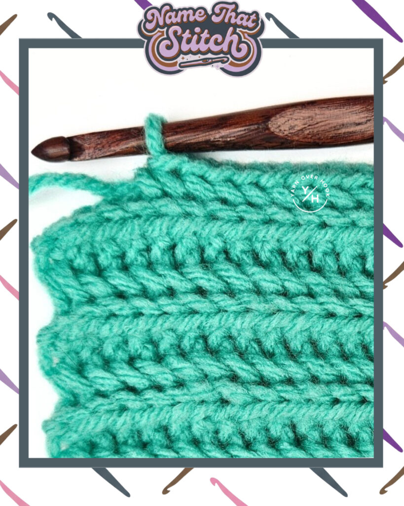 Close-up of a crocheted fabric displaying a repeating stitch pattern worked in vibrant teal yarn, with a wooden crochet hook and featured as part of the Name That Stitch daily crochet puzzle. View more at NameThatStitch.com