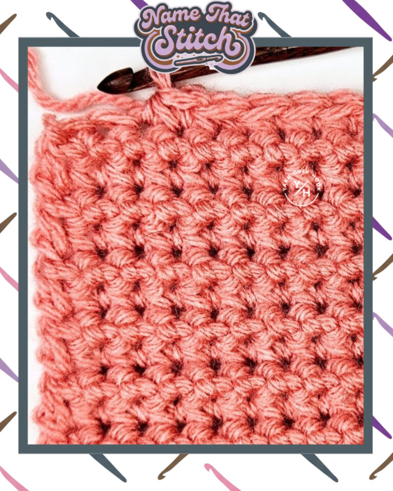 Close-up of a crocheted fabric displaying a repeating stitch pattern worked in pink yarn, with a wooden crochet hook and featured as part of the Name That Stitch daily crochet puzzle. View more at NameThatStitch.com