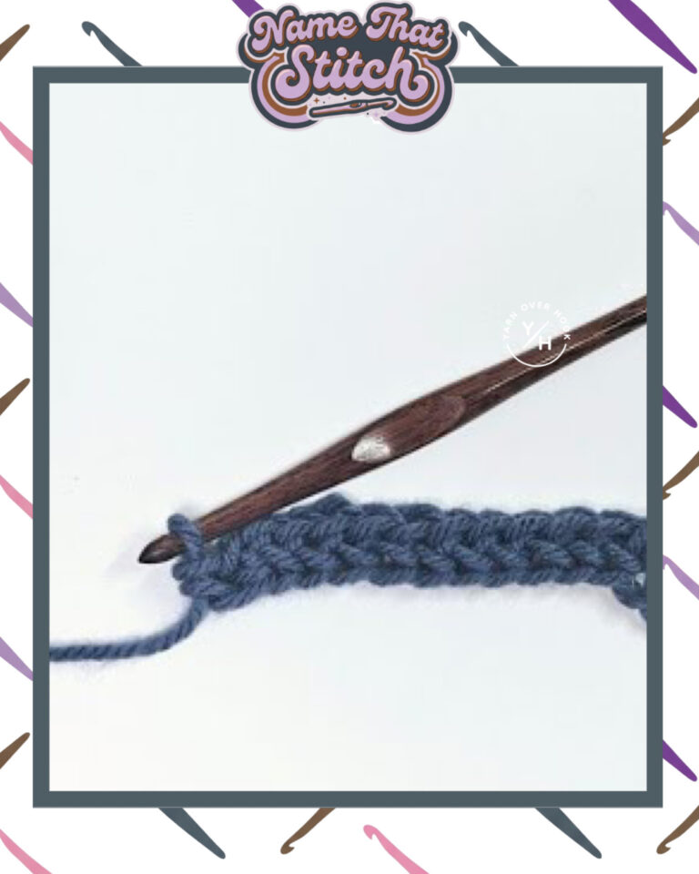 Close-up of a crocheted fabric displaying a repeating stitch pattern worked in blue yarn, with a wooden crochet hook and featured as part of the Name That Stitch daily crochet puzzle. View more at NameThatStitch.com