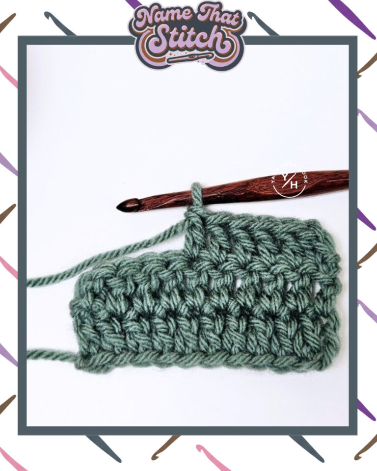 Close-up of a crocheted fabric displaying a repeating stitch pattern worked in green yarn, with a wooden crochet hook and featured as part of the Name That Stitch daily crochet puzzle. View more at NameThatStitch.com