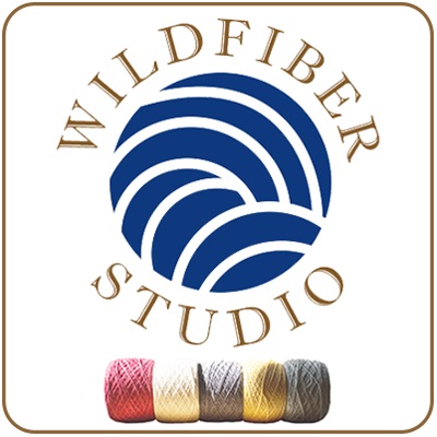 Wildfiber Studio logo featuring a blue yarn ball graphic, curved brown text, and five small yarn skeins along the bottom.