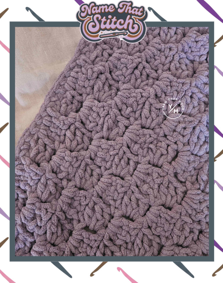 Close-up of a crocheted fabric displaying a chunky repeating stitch pattern worked in soft purple plush yarn, featured as part of the Name That Stitch daily crochet puzzle. View more at NameThatStitch.com