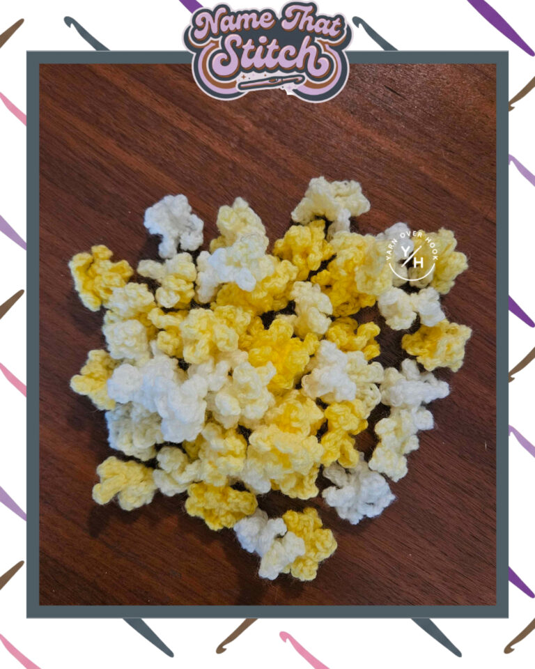 Close-up of yellow, cream, and white crocheted textured pieces arranged in a pile on a wooden surface, featured as part of the Name That Stitch daily crochet puzzle. View more at NameThatStitch.com