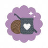 Purple scalloped maker milestone badge featuring a crocheted soap sack with a white heart, a brown ball of yarn, a crochet hook, and small sparkle accents, representing the Summer Stash Bash “Kindness in Every Stitch” achievement.