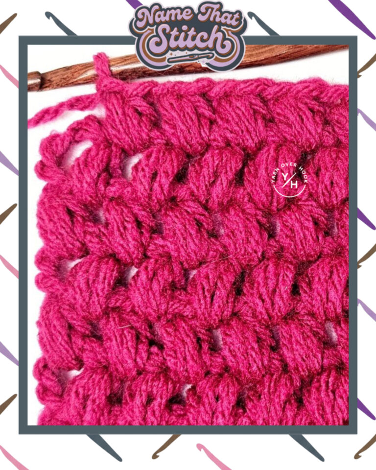 Close-up of a crocheted fabric displaying a repeating stitch pattern worked in pink colored yarn, with a wooden crochet hook and featured as part of the Name That Stitch daily crochet puzzle. View more at NameThatStitch.com