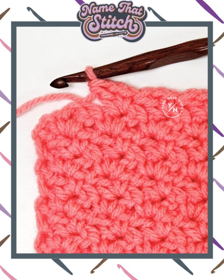 Close-up of a crocheted fabric displaying a repeating stitch pattern worked in peach colored yarn, with a wooden crochet hook and featured as part of the Name That Stitch daily crochet puzzle. View more at NameThatStitch.com